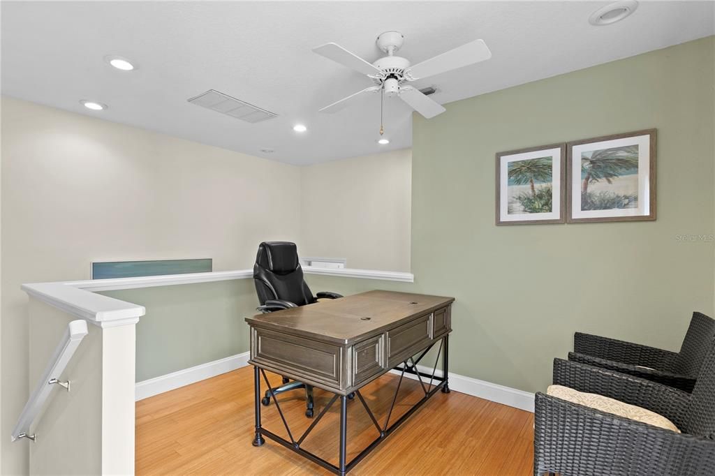 Adjacent to the primary suite is a comfortable loft/office/den with access to a balcony for enjoying cool breezes.