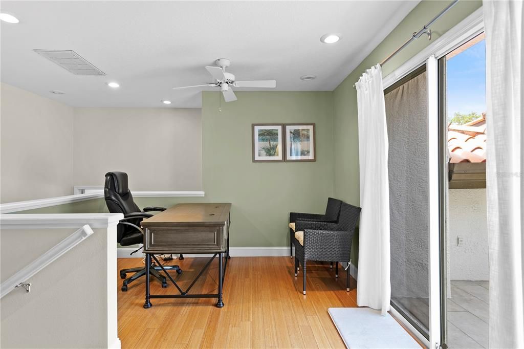 Adjacent to the primary suite is a comfortable loft/office/den with access to a balcony for enjoying cool breezes.