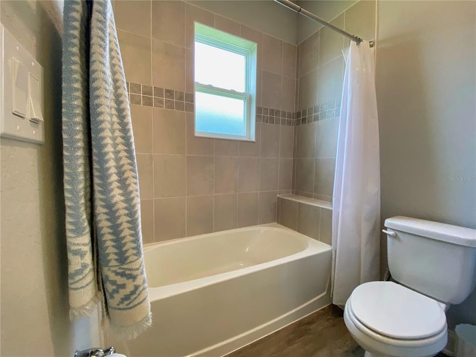 Shower/Tub Combo with Window for Additional lighting in Bathroom 2