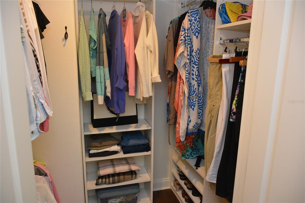 1 of 2 Walk-in closets in primary bedroom