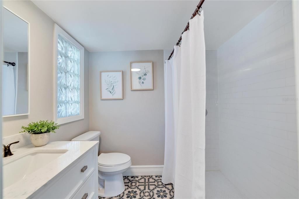 En-suite with generous walk-in tiled shower.