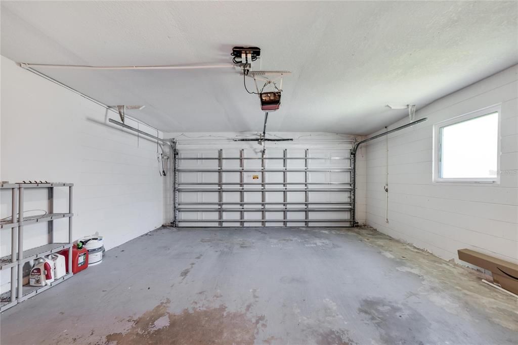 Store your vehicles and outdoor toys in the large garage with newer impact rated garage door.