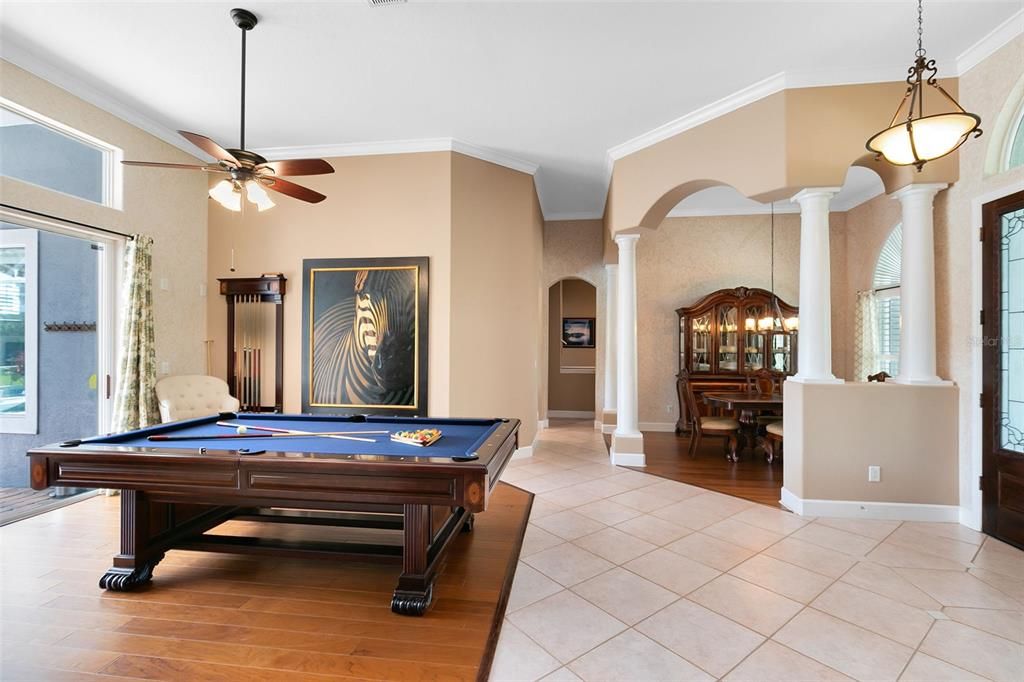 If a huge dining room is needed, just position your dining table where the pool table is located.