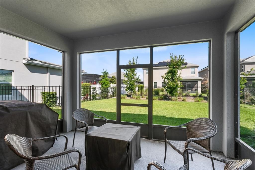 The thoughtful landscaping and fenced yard gives you a headstart on creating the outdoor space of your dreams and you can enjoy it all from the covered/screened lanai!