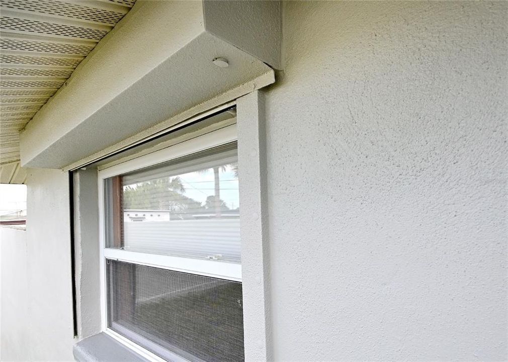 Electric roll down hurricane shutters on all window/door openings.