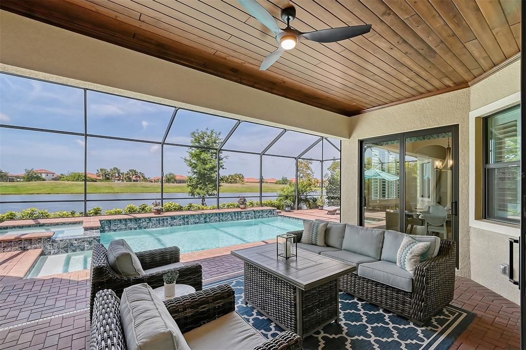 Spacious lanai and pool area overlooking lake and golf course.