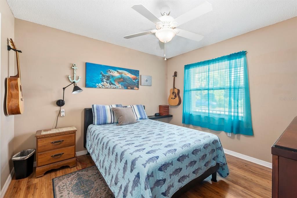 Guest bedroom looks out to the front of the home.