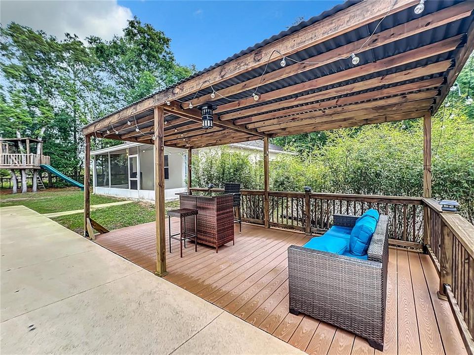 Covered deck perfect for entertaining poolside