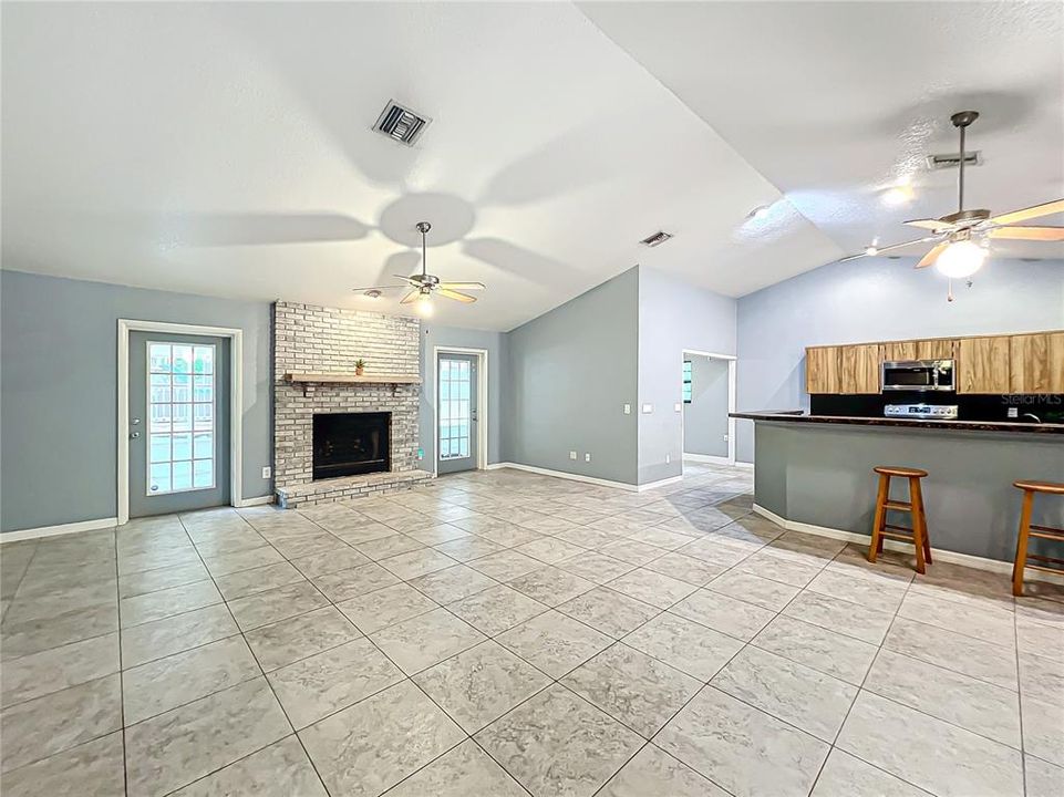 Living room and dining area looking into kitchen