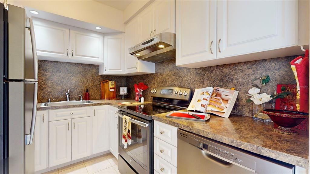 It's a galley kitchen but is bright, has a good amount of cabinet space, and a decent amount of counter space.