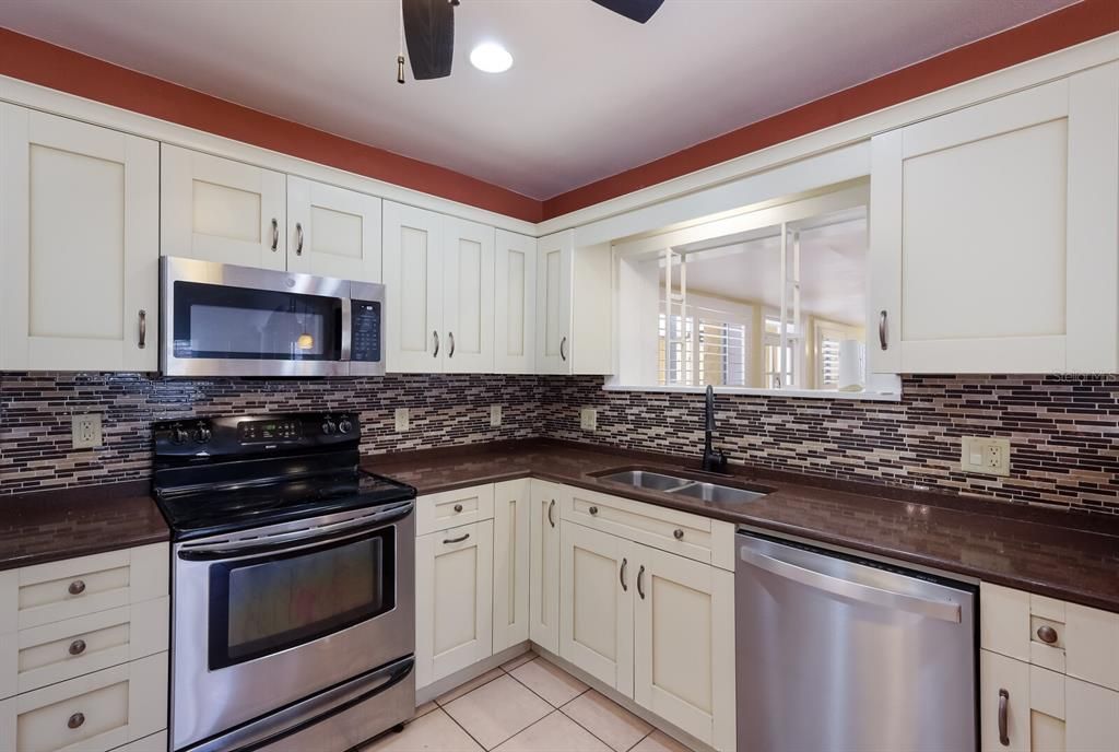 Granite counter tops and SS appliances in kitchen