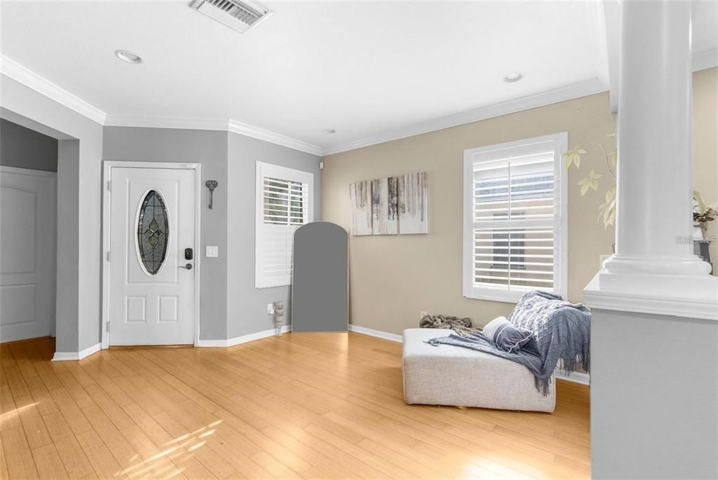 View of front door and bonus lounge area from living room - 12119 DEERTRACK LOOP