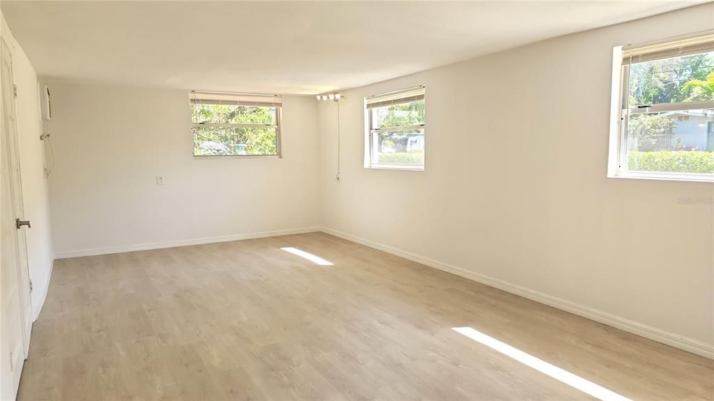 Large Family Room with lots of natural lighting.