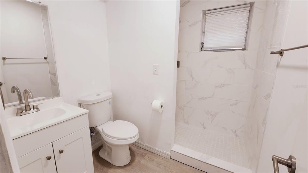 Newly remodeled bathroom with large walk in shower.