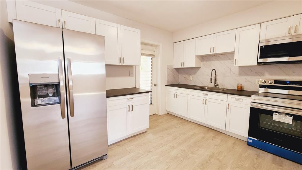 Newly remodeled kitchen with new appliances.