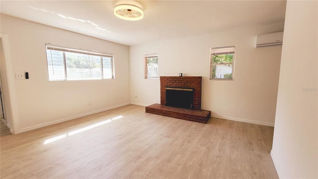 Large living room with fireplace.