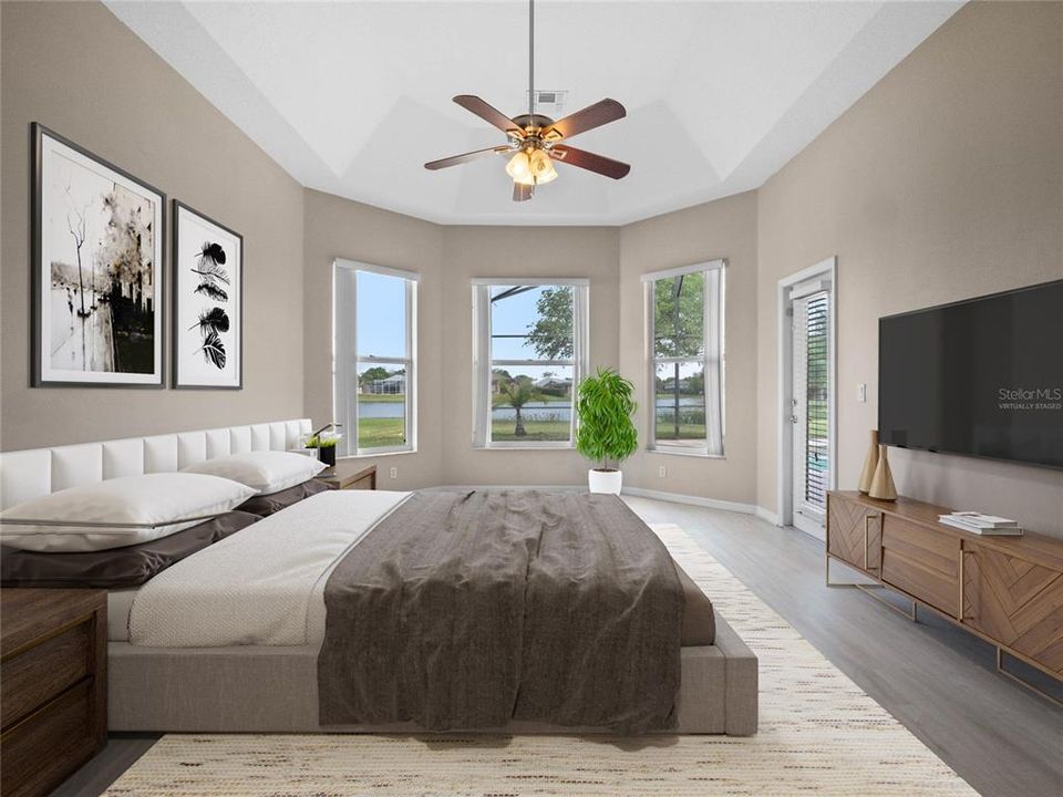 The PRIMARY SUITE is a must see with BAY WINDOWS framing the beautiful view, direct access to the lanai, WALK-IN CLOSET and private en-suite bath. Virtually Staged.