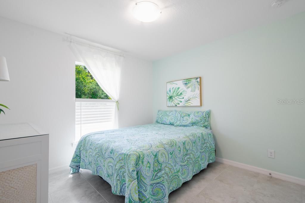GUEST ROOM: QUEEN SIZE BED is shown