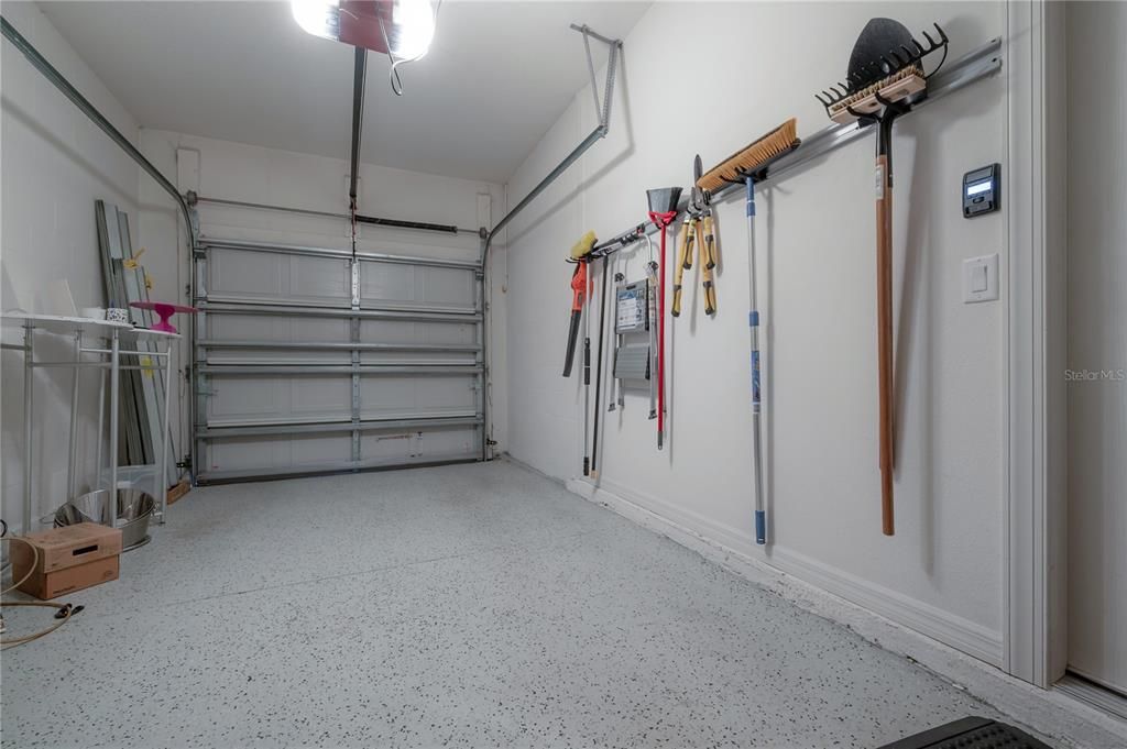 Garage epoxy floor and oUpgraded belt driven garage door.