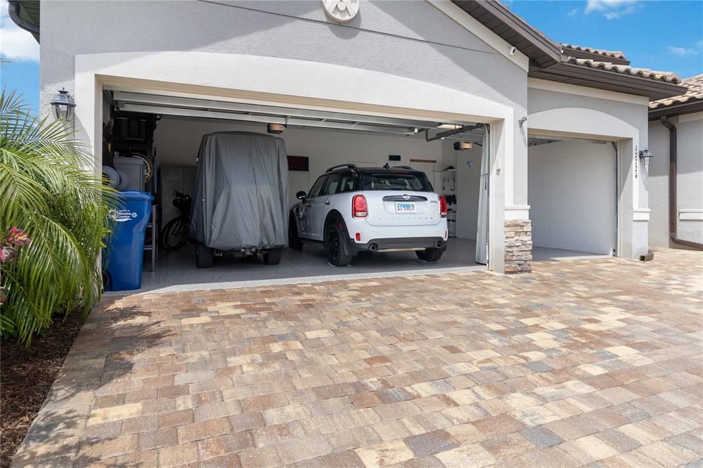 Three Car Garage with Epoxied Floor and Tons of Storage plus Extra Refrigerator!