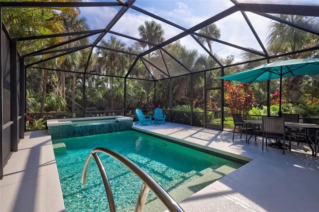 Live outdoors in this fabulous setting! The trees and privacy are unbelievable! No Seeum screens on pool cage within last year.