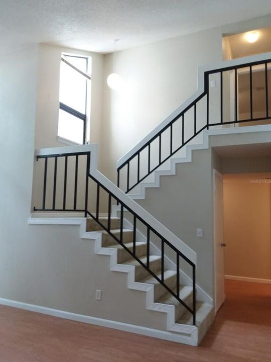Stairway to the second and third large bedrooms