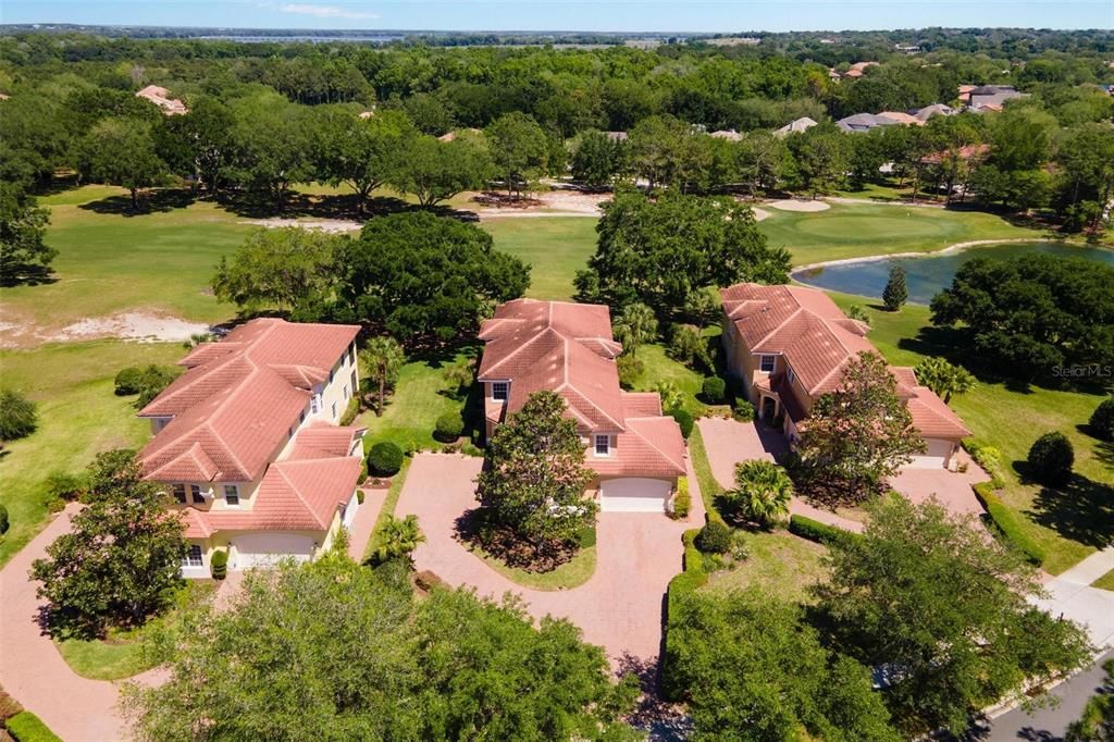 Aerial of Property with Pond and Golf Course Views