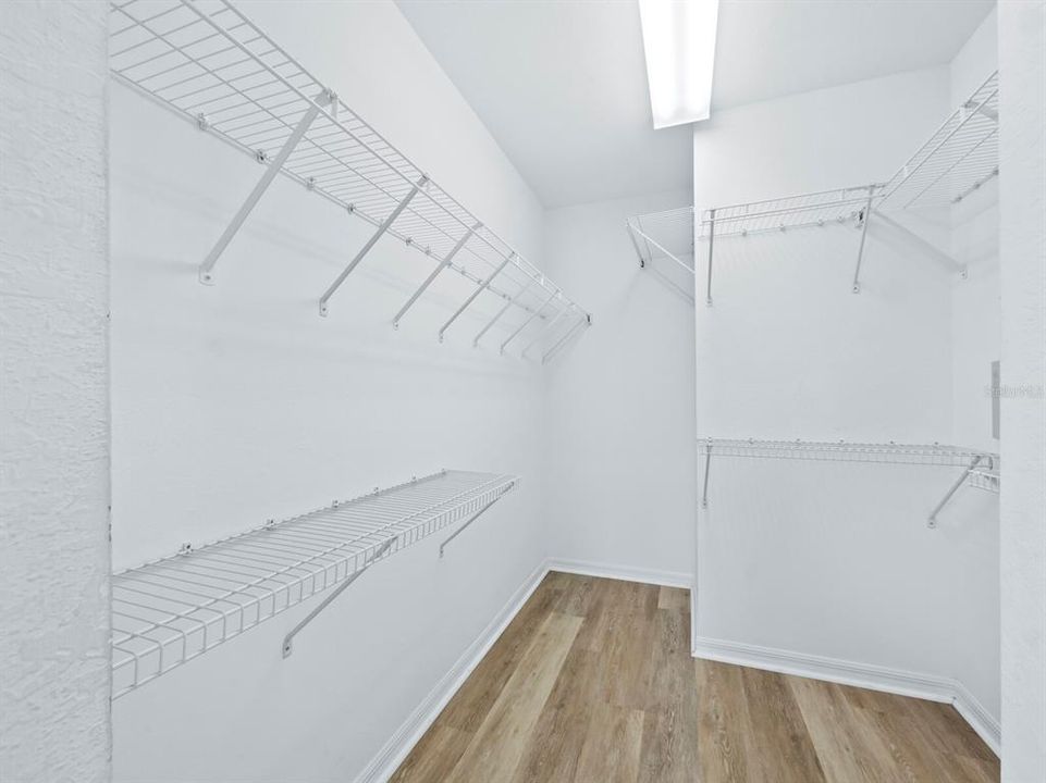 The large primary suite walk-in closet