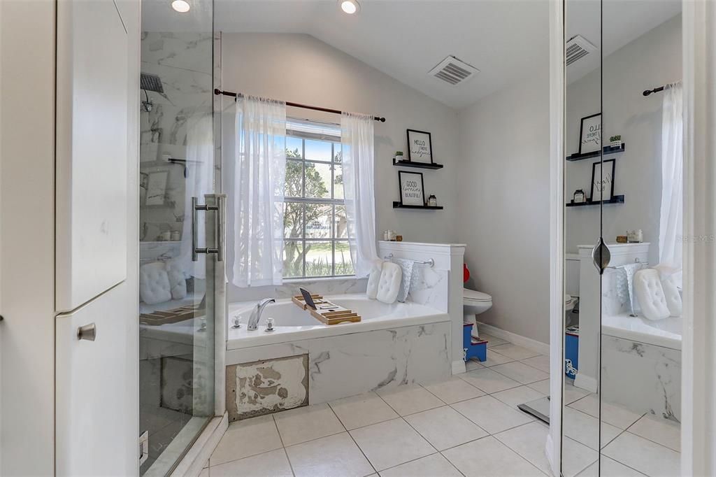 Walk in closet, tiled shower & separate tub