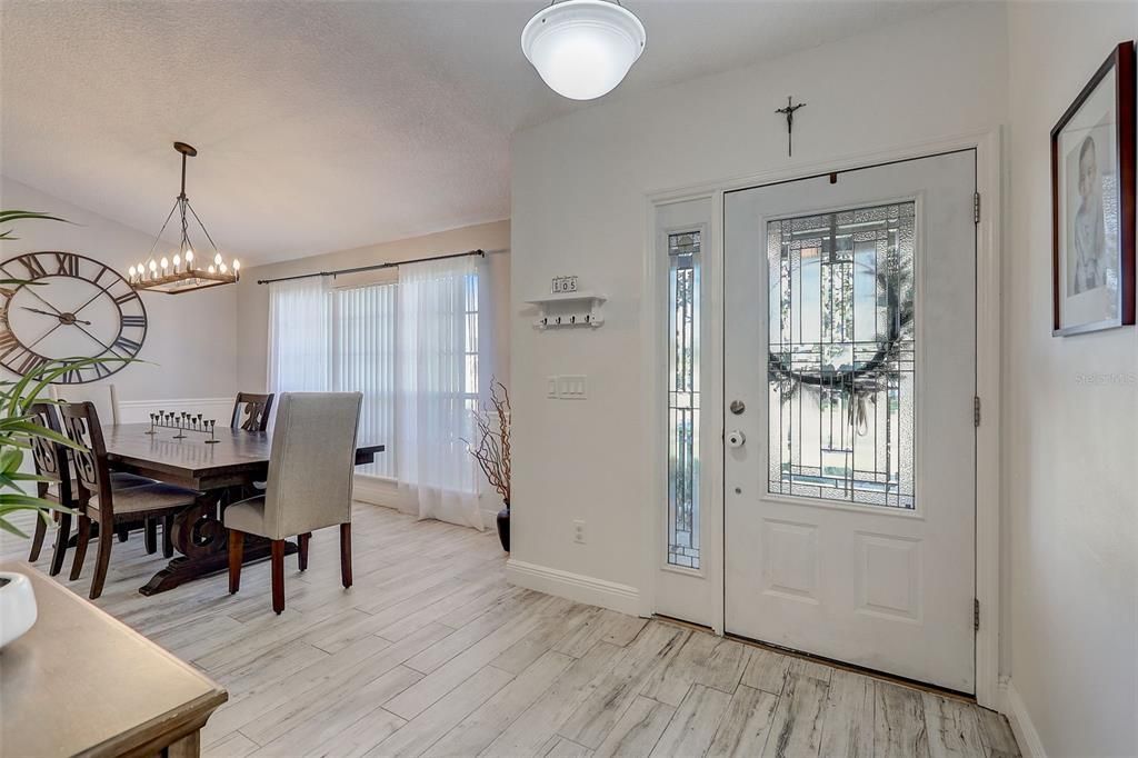Just wow! Updates galore in this 3 bedroom, 2 bathroom pool home. Entry way with spacious & bright formal dining room