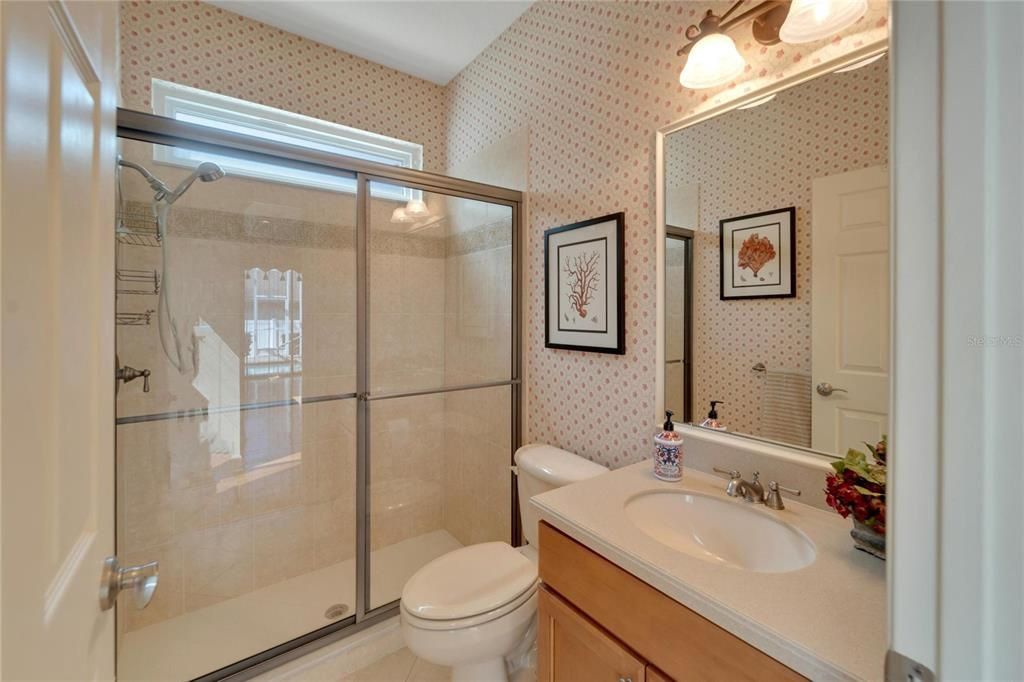 Look at that AWESOME walk-in shower. This bathroom also doubles as the pool bath.