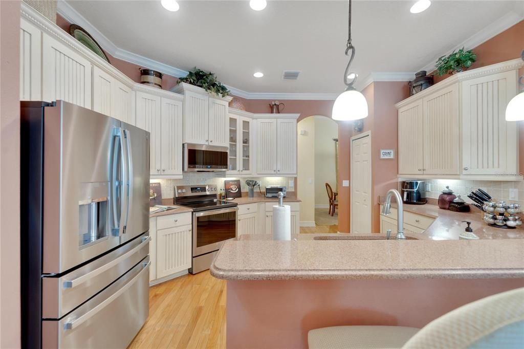 Beautiful French Provincal Style Wood Cabinets with Crown Molding and Granite Counters, Undermount Lighting are just a few examples of all the upgrades that this home has to offer.