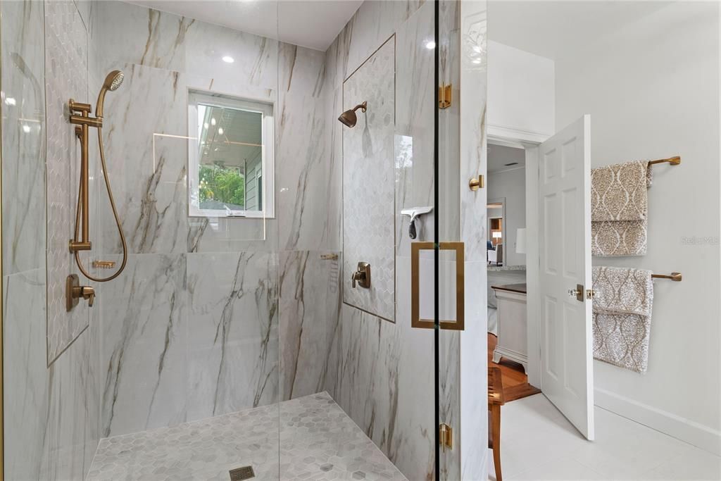 Primary bathroom walk-in, glass-enclosed shower