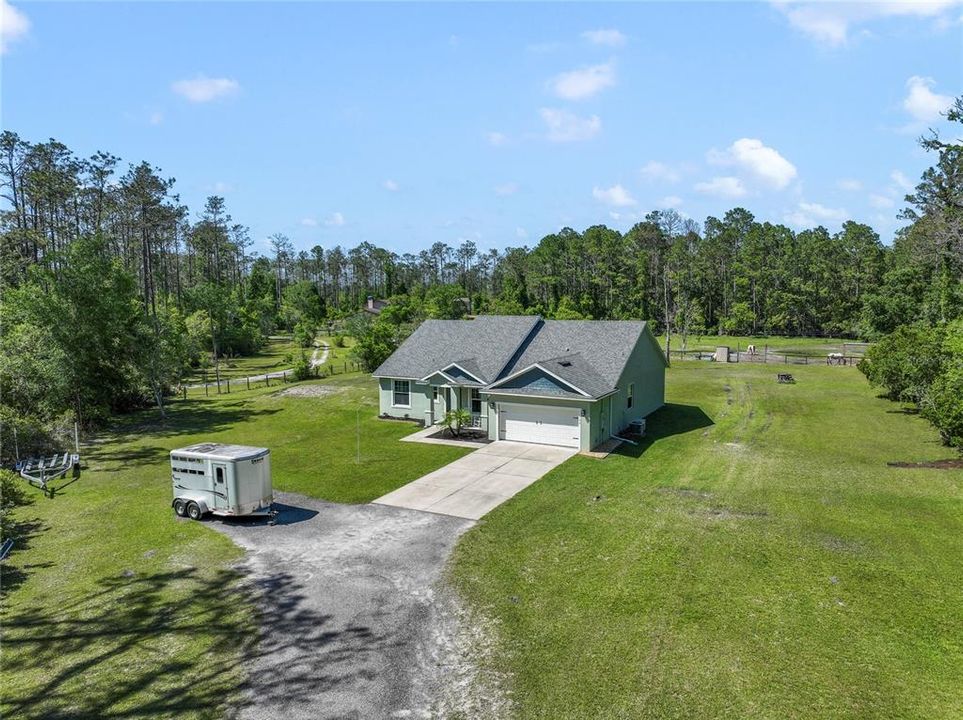 Welcome to Plantation Pines and your new home sweet home! Tucked away on OVER TWO ACRES (2.39) this NEWLY BUILT HOME (2018) delivers 4-bedrooms, 2.5-baths, a bright OPEN CONCEPT, all the UPGRADES you could want and the best part is you can BRING YOUR HORSES or your chickens!