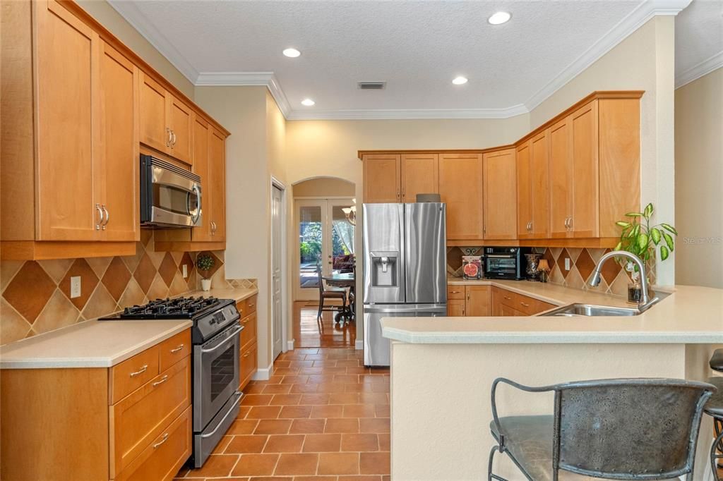 The kitchen opens to dining and a covered rear patio with spacious entertaining area.