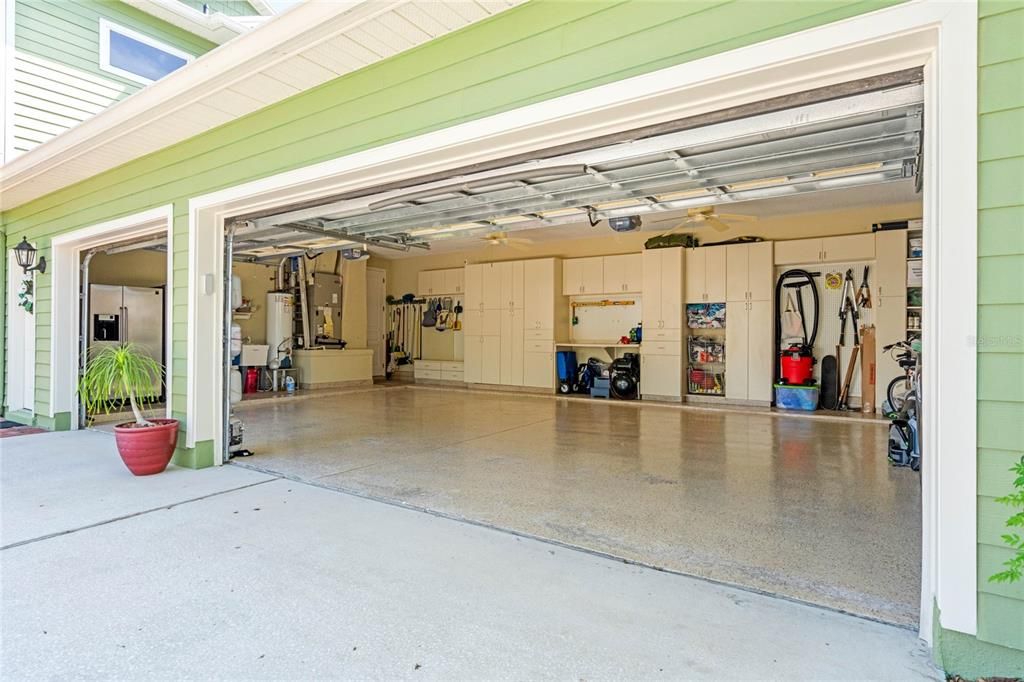 Oversized three car garage with custom storage system and room for your golf cart