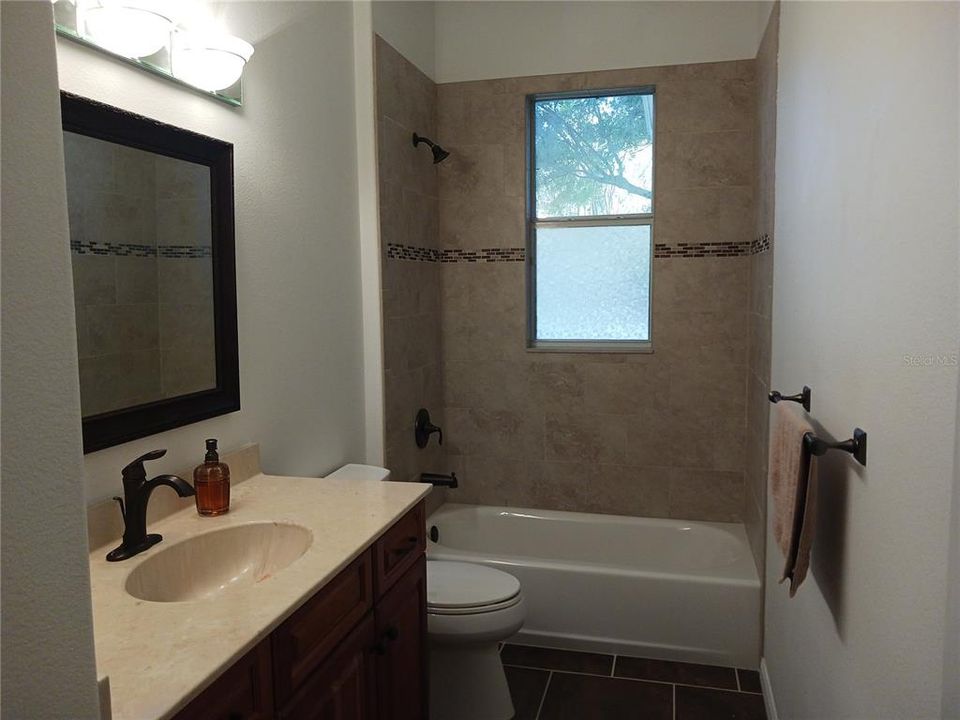 Guest bathroom with linen closet  6614 Sinisi Dr Mt Dora FL Chesterhill Estates