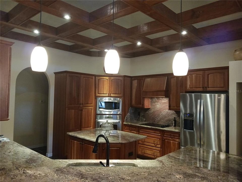 Kitchen with accent wood beams Chesterhill Estates 6614 Sinisi Dr Mt Dora FL