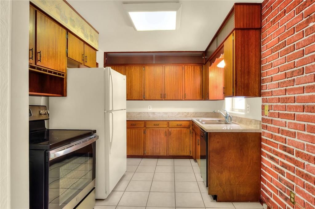 Kitchen w/original hardwood cabinets.