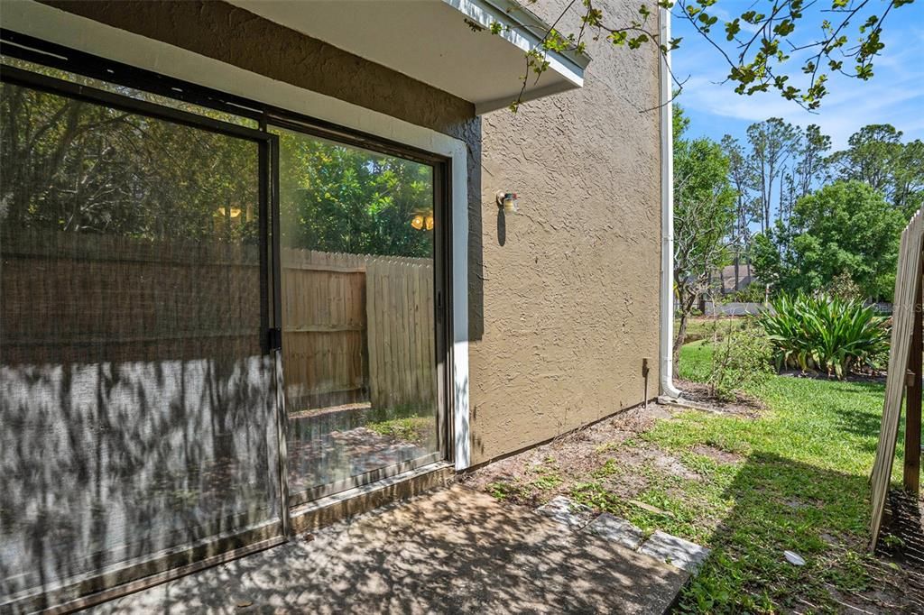 side patio with privacy fence
