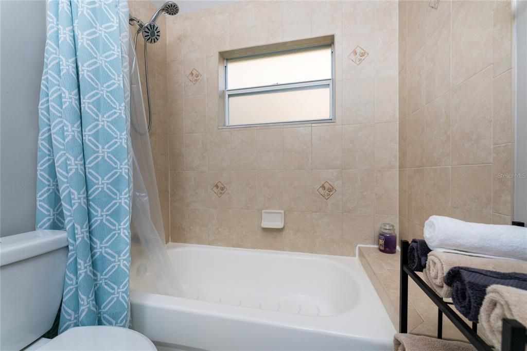 Tub/Shower Combo with Obscured Glass Window and new Toilet