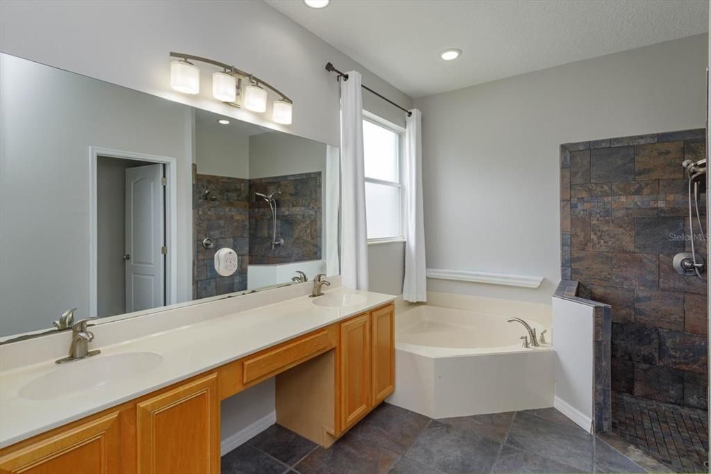MASTER BATH OFFERS DUAL VANITY SINKS, GARDEN TUB AND SEPARATE SHOWER WITH WATER CLOSET