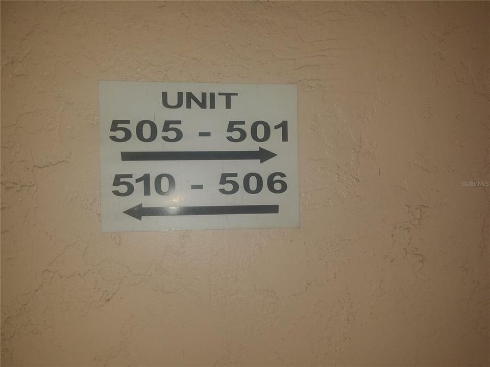 Condo number signage in front of elevator