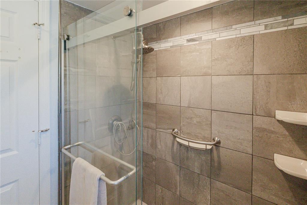 Master shower and water closet area separate from vanity space