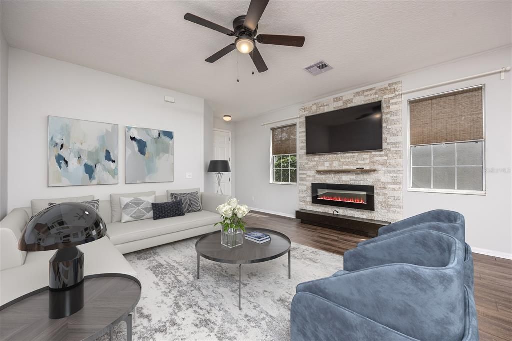Living Area with Fireplace accented wall STAGED PHOTO