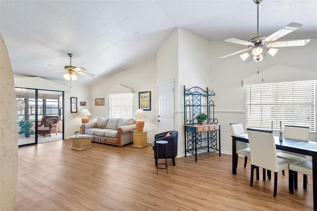 HIGH CEILINGS AND EASY TO CARE FOR WOOD LIKE FLOORS