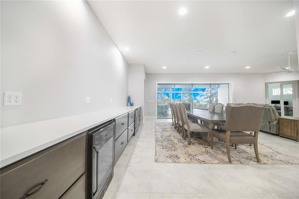 Dining Area has Built in Buffet with Quartzite Countertop and Two Beverage Fridges