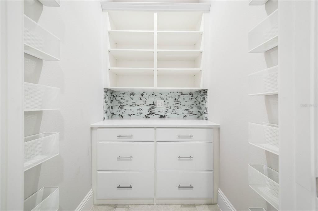 Downstairs Hall Closet Storage is Light and Bright and Organized