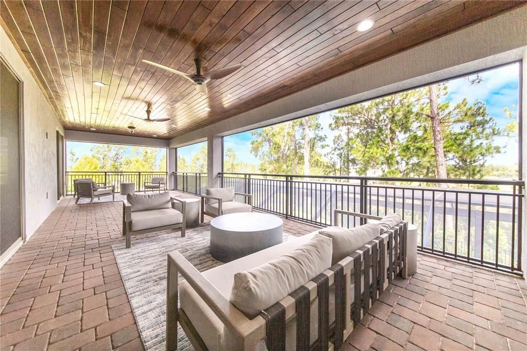 Upstairs Balcony is pavered and screened with an exotic wood ceiling and Stunning Lake Views