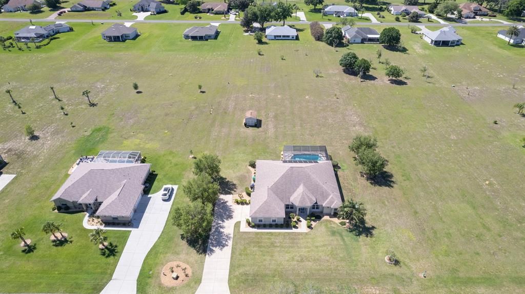 Expansive Aerial Front View of Home & Neighborhood